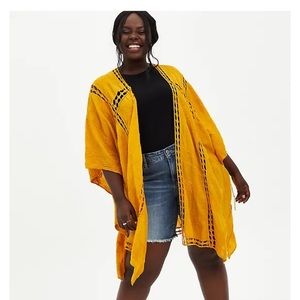 TORRID GOLD EYELET INSET RUANA